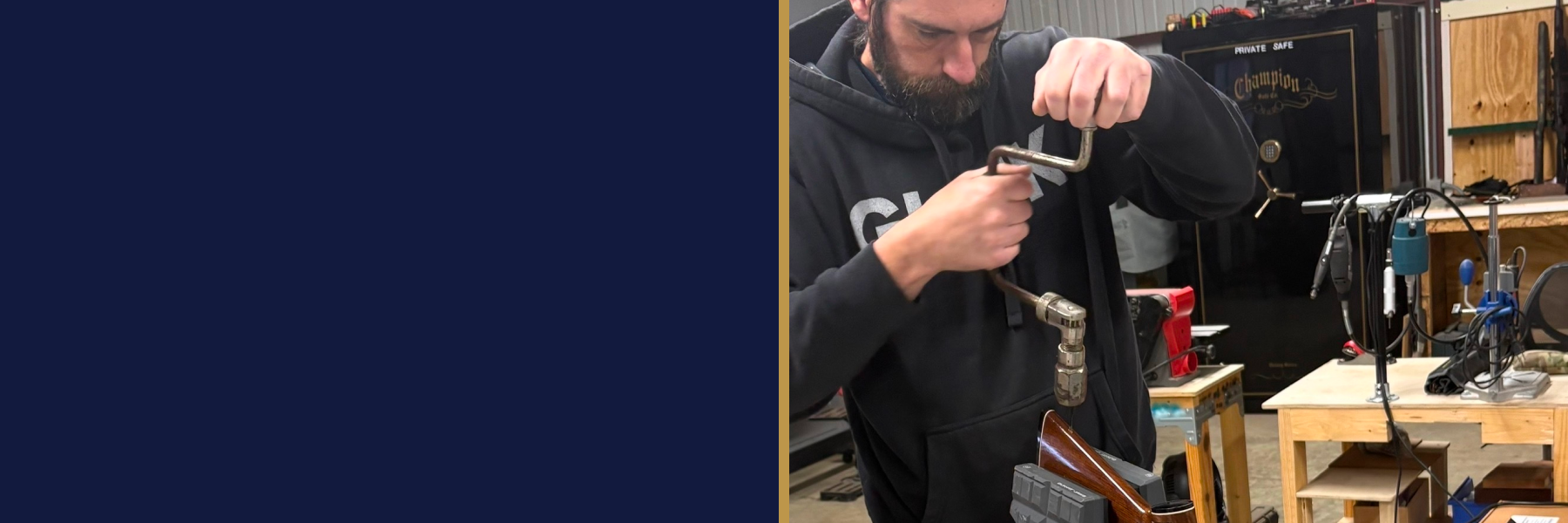 Gunsmith working on a firearm in a professional workshop